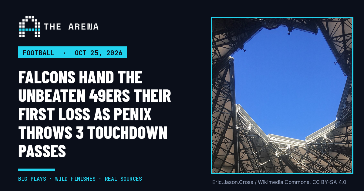 Looking up through the open roof of Mercedes-Benz Stadium in Atlanta toward a blue sky
